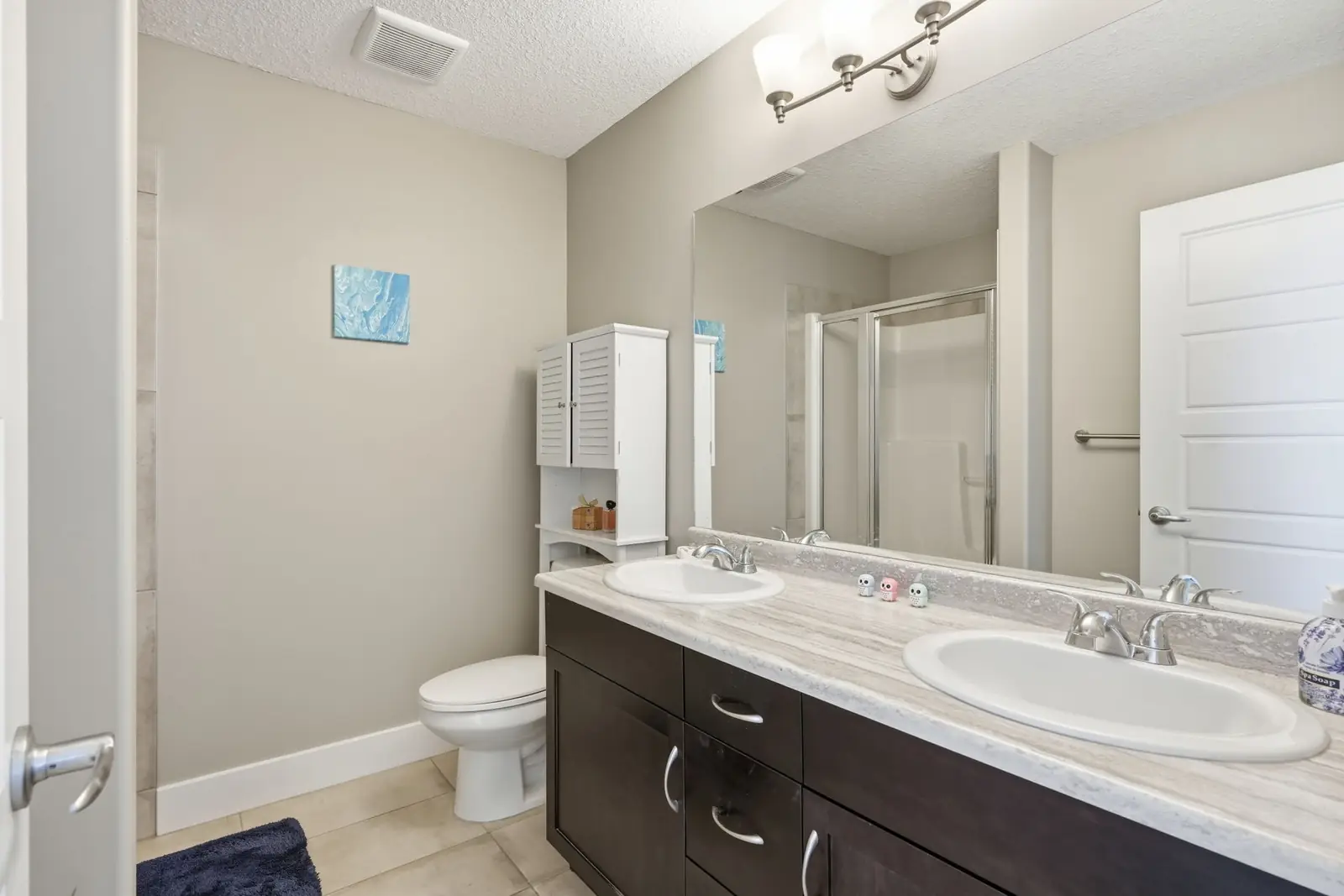 Ensuite with dual sinks and a walk-in shower