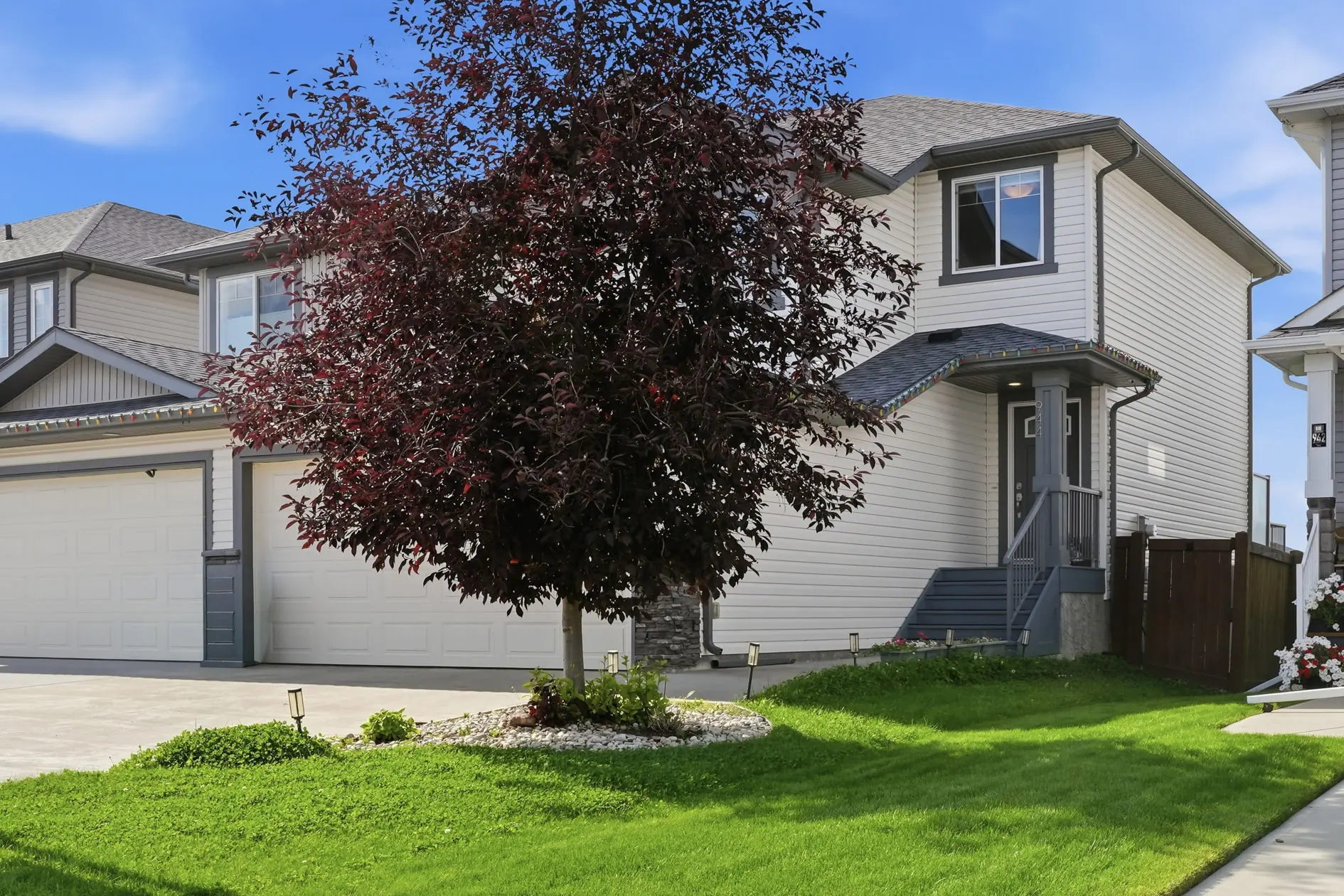 Front elevation of 944 Morris Way, a two-storey half duplex in Meadowview Park, Leduc